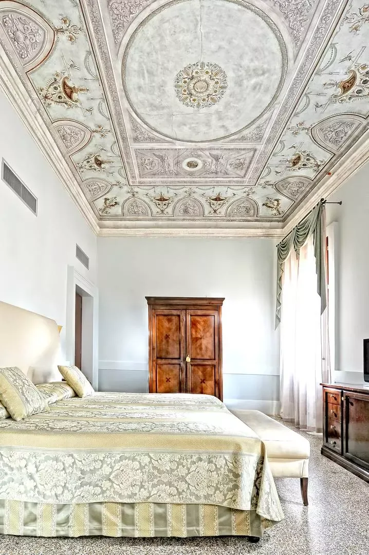 Original 16th-century fresco on the ceiling of a Deluxe room at Palazzo Vitturi