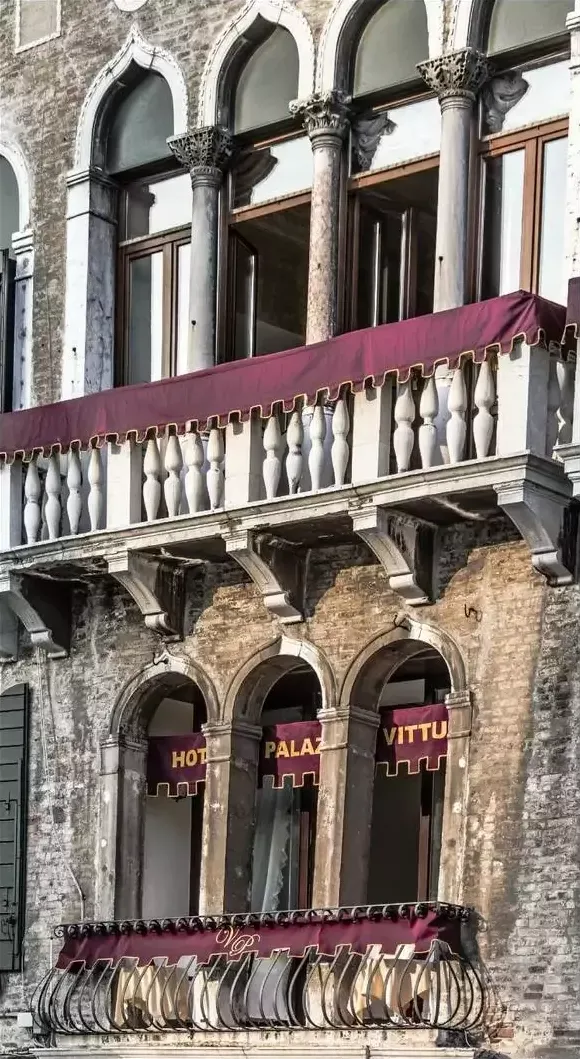 The gothic balcony on the historic facade of Palazzo Vitturi