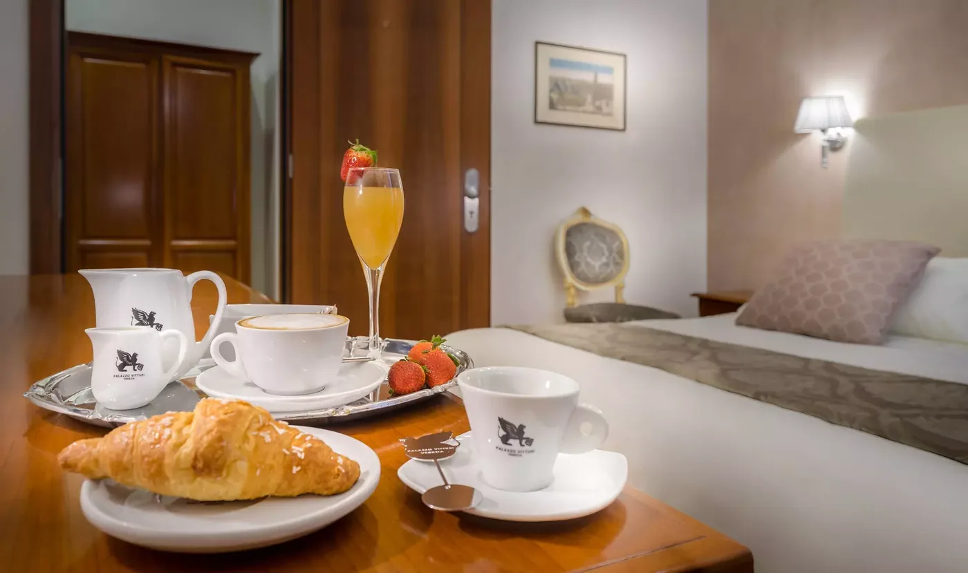 Breakfast served in the room at Palazzo Vitturi with croissants and coffee
