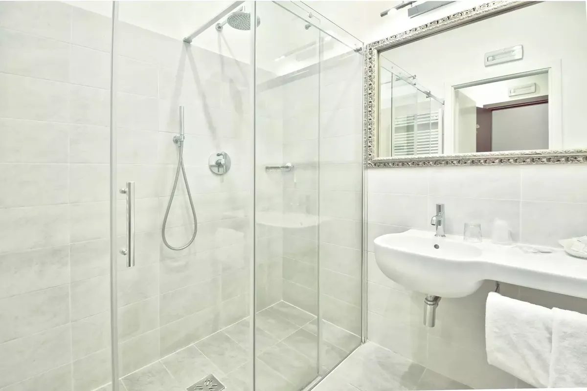 Marble bathroom with walk-in shower at Palazzo Vitturi