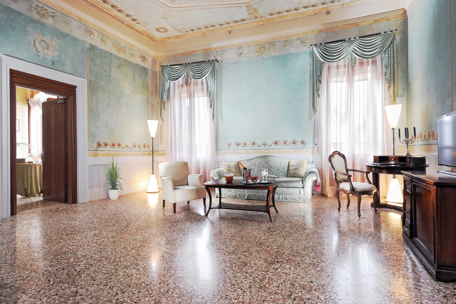 The frescoed lounge of the Suite at Palazzo Vitturi