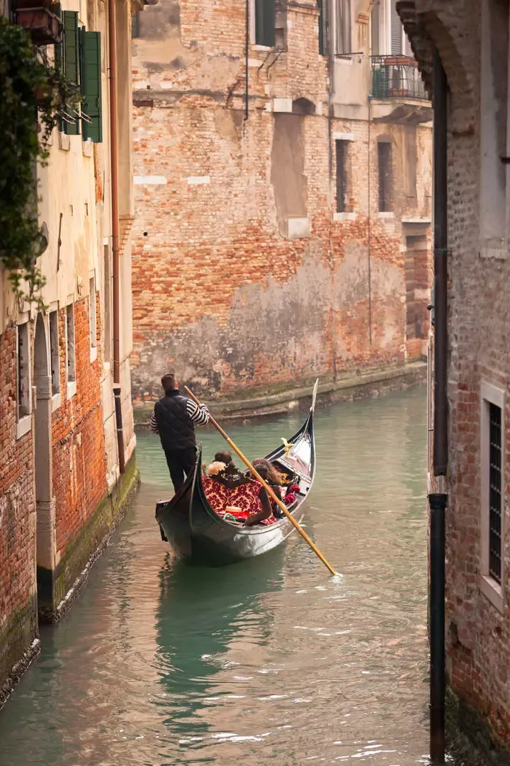 A gondola in a canal of the Castello district in Venice